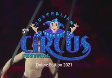 A man performs straps behind the Australian Circus Festival logo