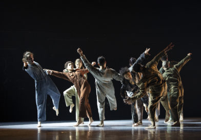 Performers standing on stage