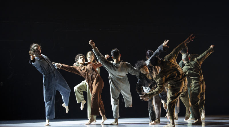 Performers standing on stage
