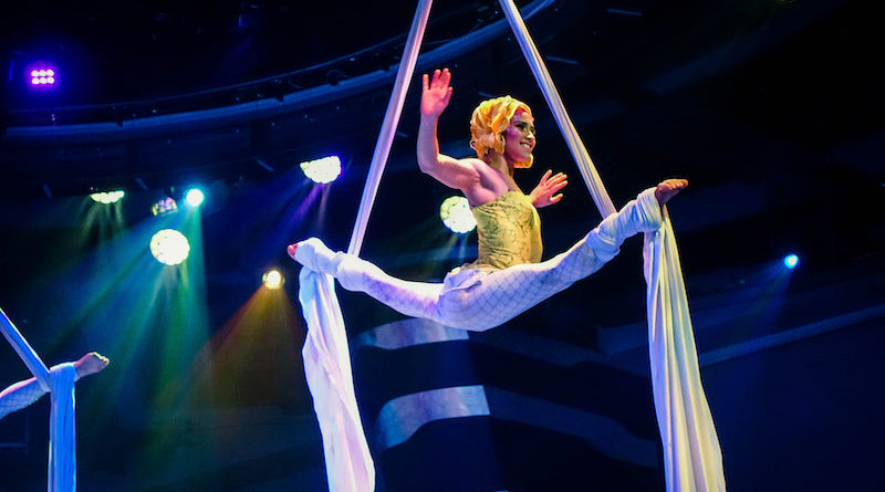 Silvia Dopazo performs a split balance on aerial silks