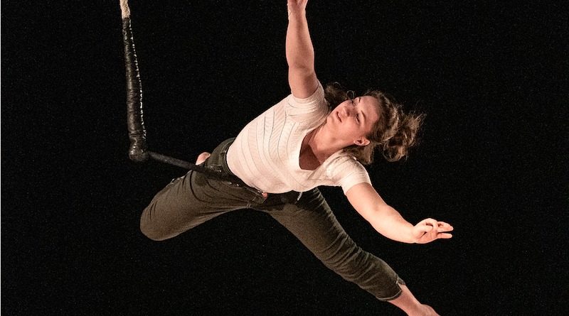 Constance Dansart hangs from a static trapeze