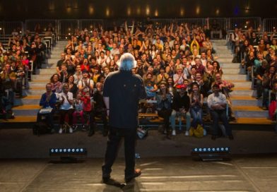 Donald Lehn faces an audience on stage