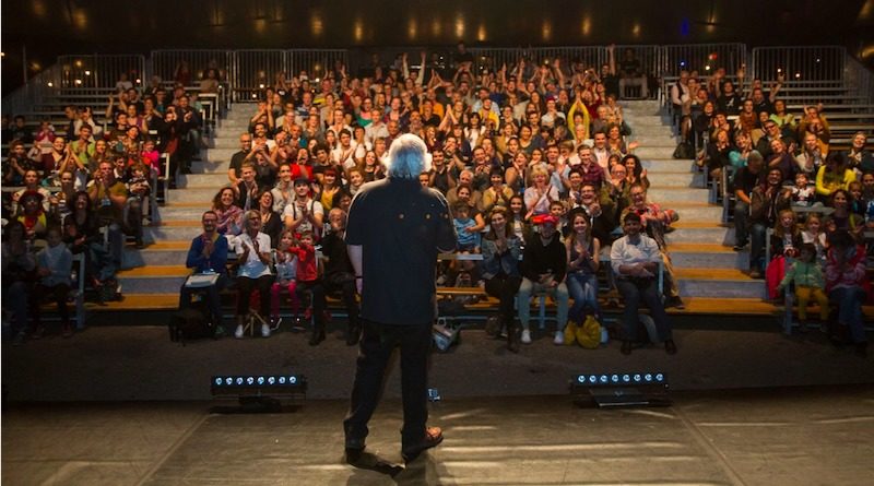 Donald Lehn faces an audience on stage