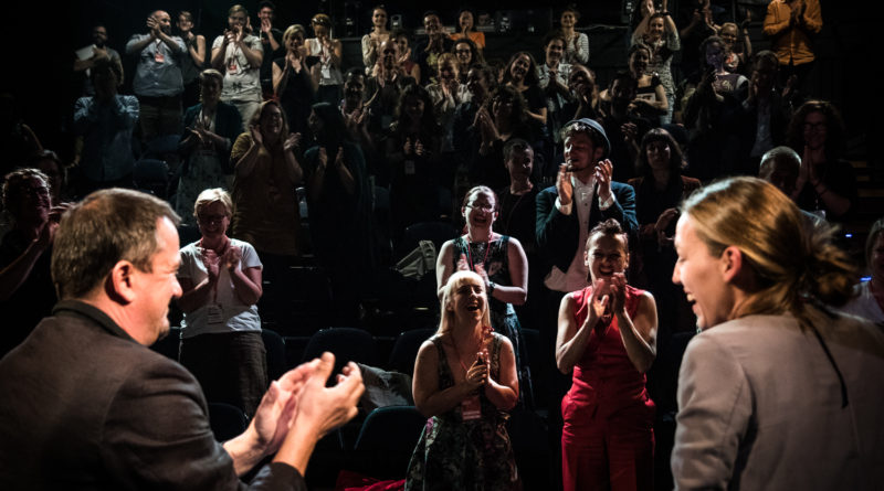 two presenters in the foreground are greeted with a standing ovation. Circus and its Other conference 2018 Prague