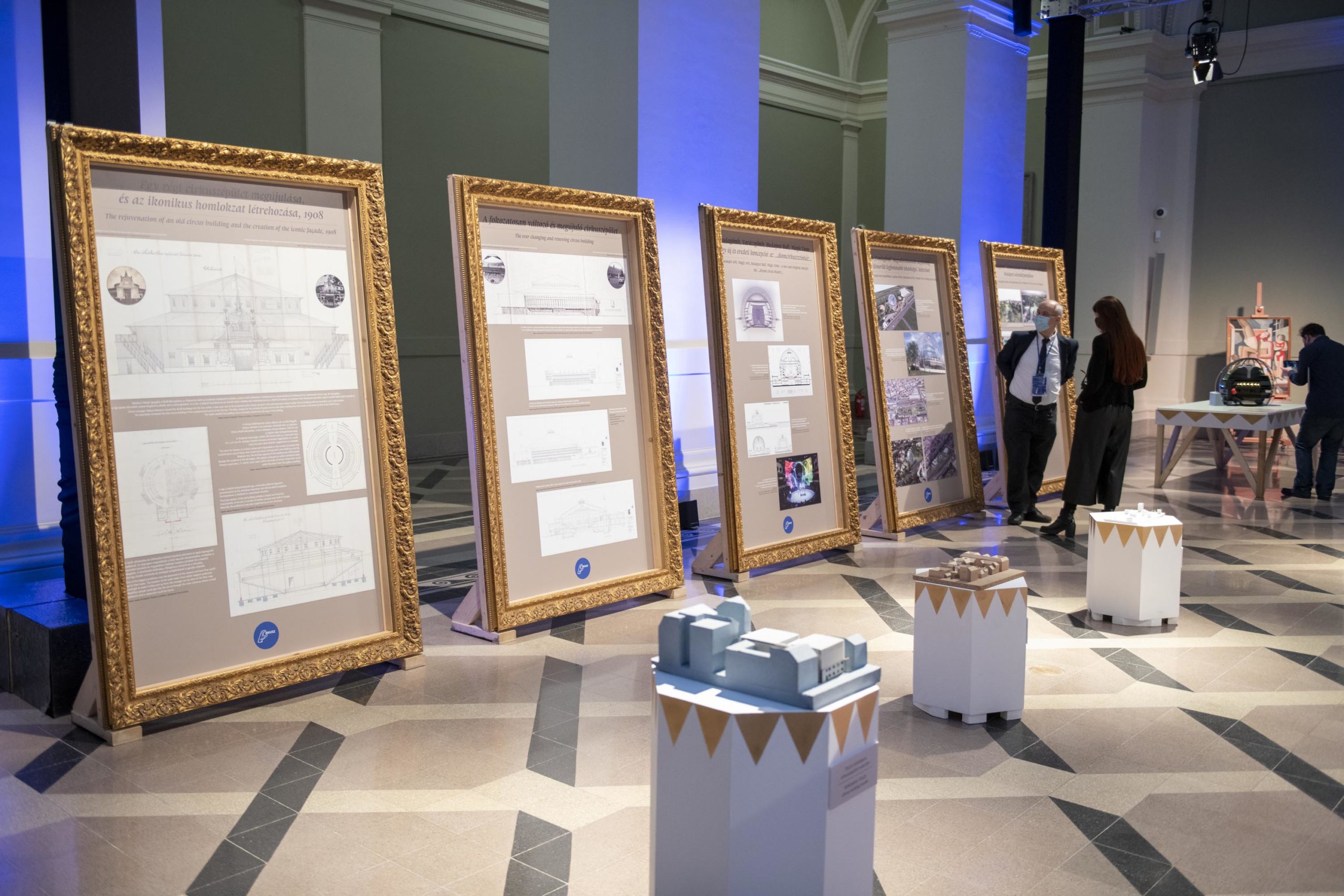 Drawings and prints of circus building plans, displayed in five gold frames at the Circus Buildings in Europe exhibit