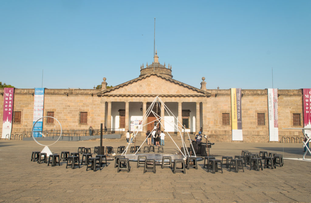 Performance of circus show Disonante in Guadalajara, Mexico. Performers set up a triangular apparatus.