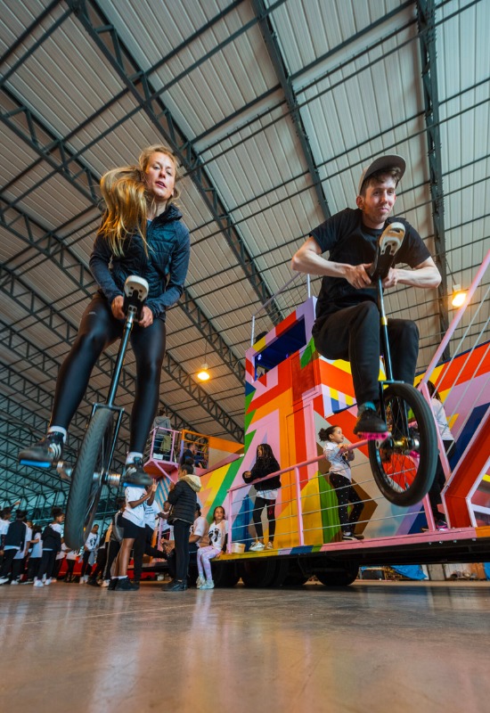 Cirque Bijou unicyclists practice bunnyhopping while navigating set pieces for the Queen's Platinum Jubilee Pageant