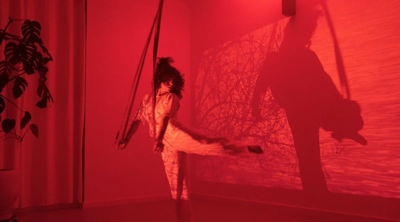 Rosiris Garrido, aerialist and pilates teacher, performs on straps in her Berlin studio. Part of her one-woman show "What Can I Offer You Today?"