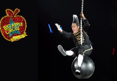 Comedian and daredevil Johnny Rocket rides on a wrecking ball to greet Big Apple Circus audiences