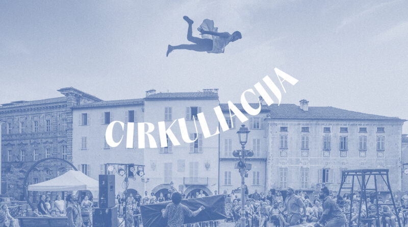 A circus artist flies above the audience outdoors at the Cirkuliacija Contemporary Circus
