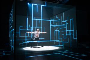 At the 2019 Show Your Show Creative Conference, a male circus performer shows off an advanced lighting projection stage